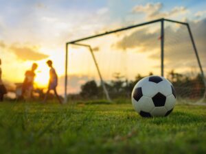 soccer field with a couple playing football